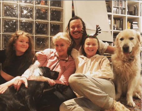 greta with her mum dad sister and dog 